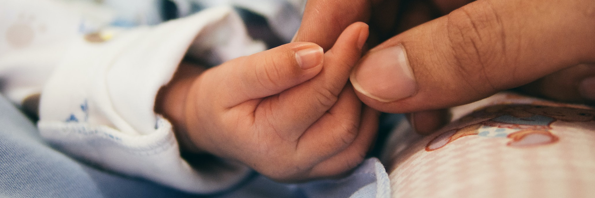 Touching a babies hand